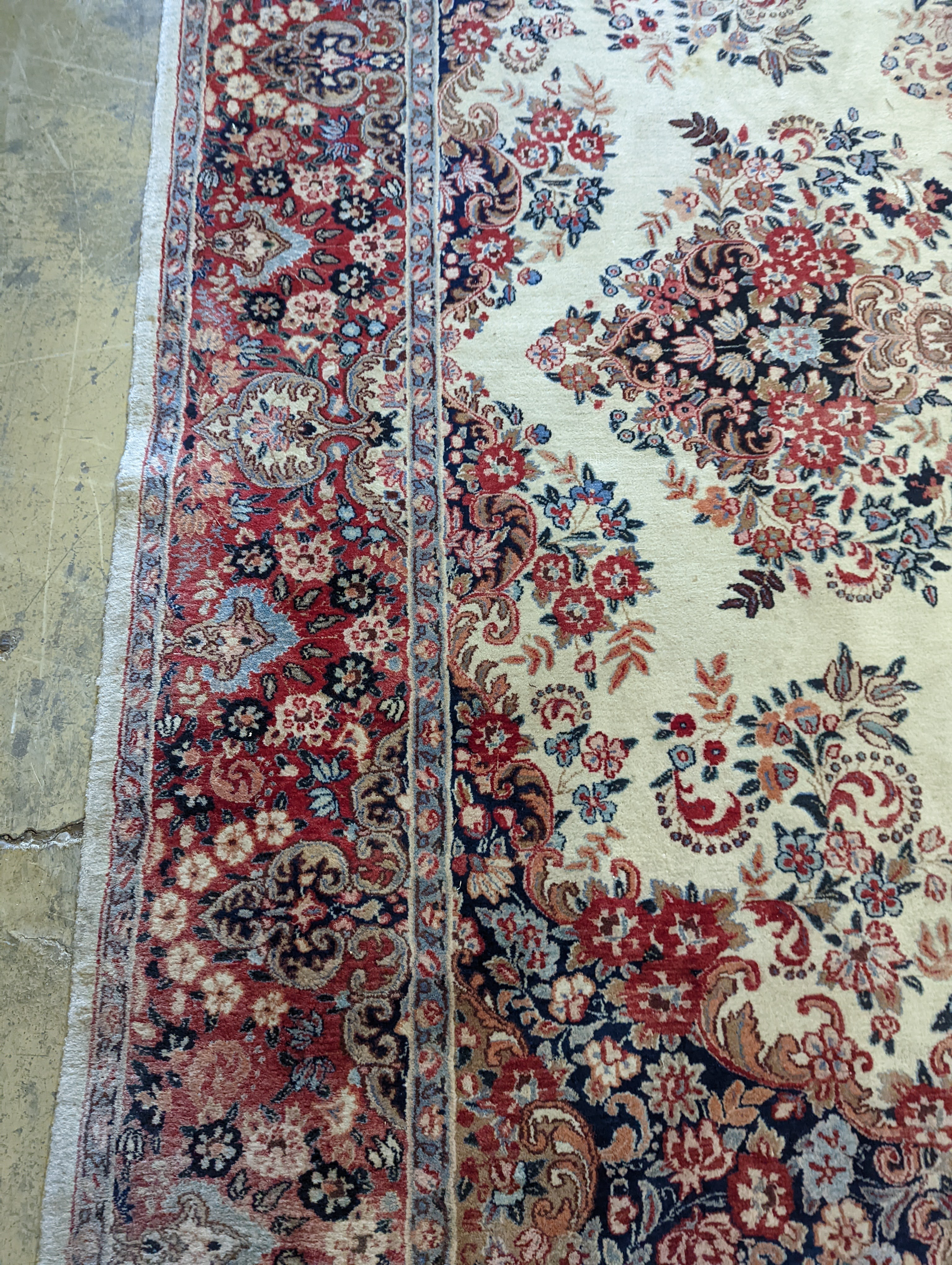 A North West Persian ivory ground carpet, 410 x 310cm